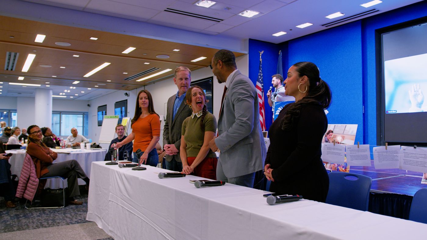Elected officials standing at the head table during the NYCAT lightning round