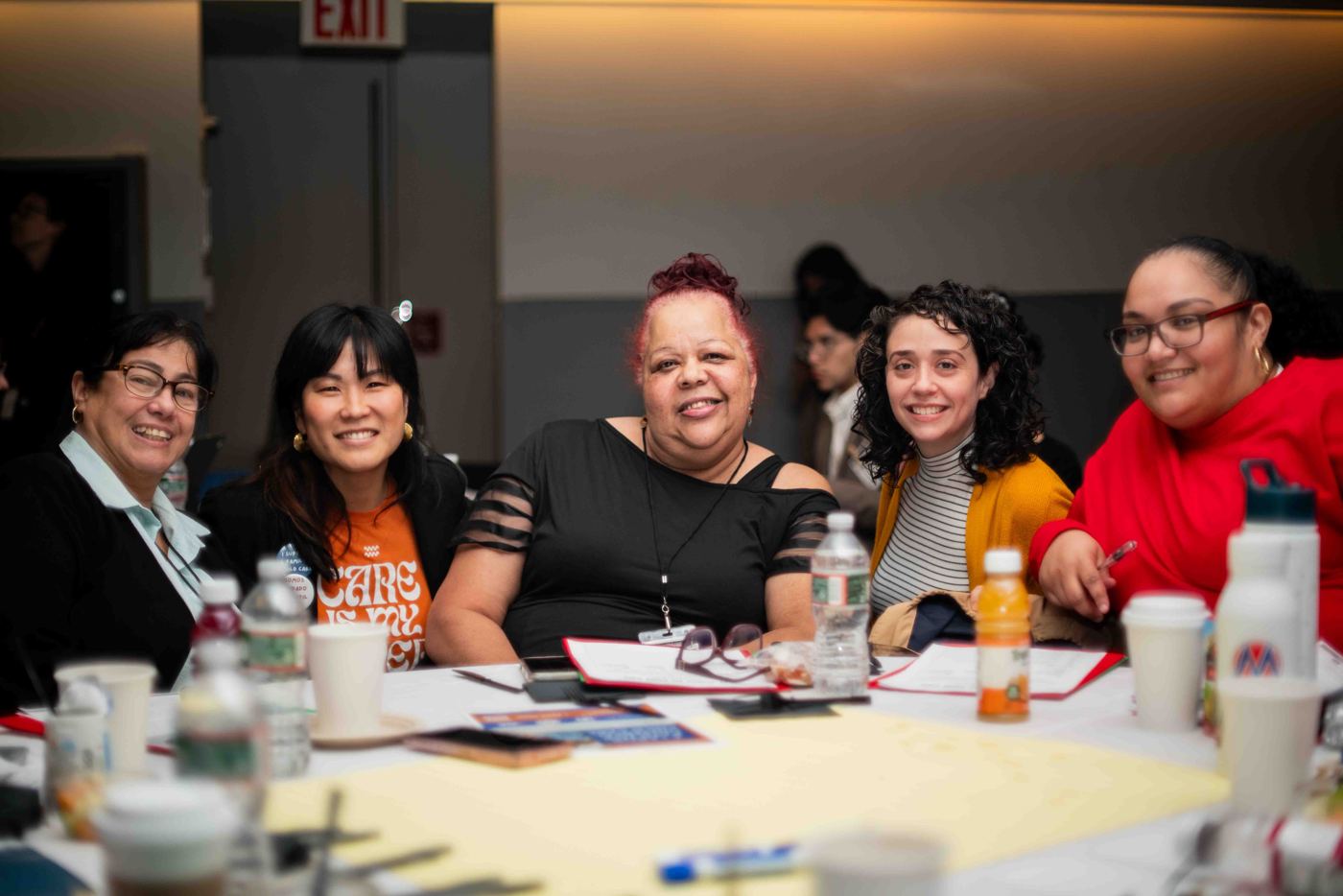 Providers and advocates around a table at the NYCAT convening